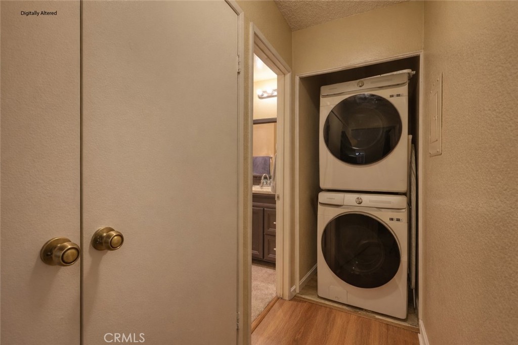 1800 East Old Ranch Road, Unit 148 Colton, CA 92324 - Photo 10 of 16 a view of a hallway with washer and dryer
