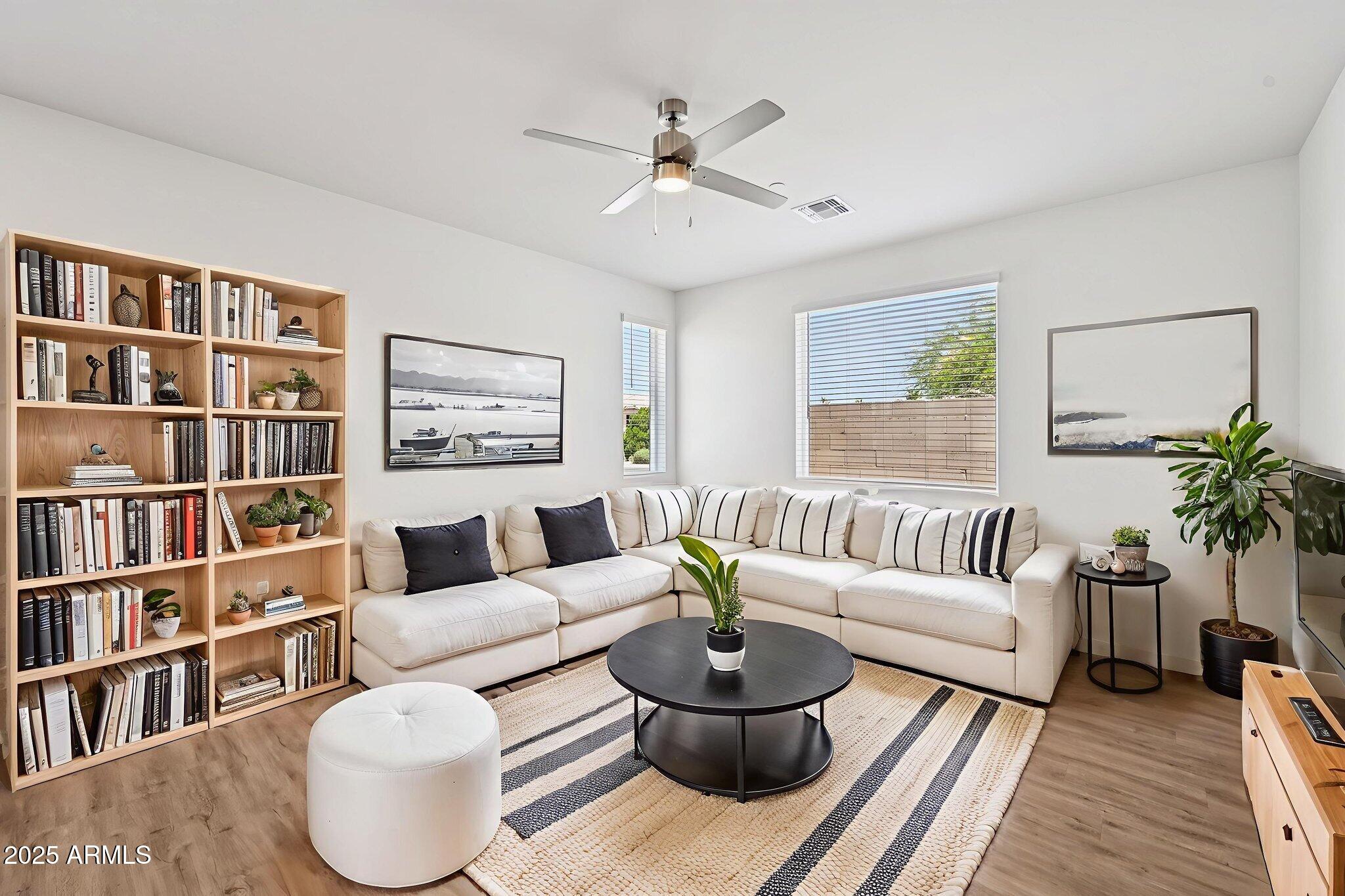 2131 East Jennifer Lynn Way Phoenix, AZ 85022 - Photo 15 of 45 a living room with furniture and a book shelf