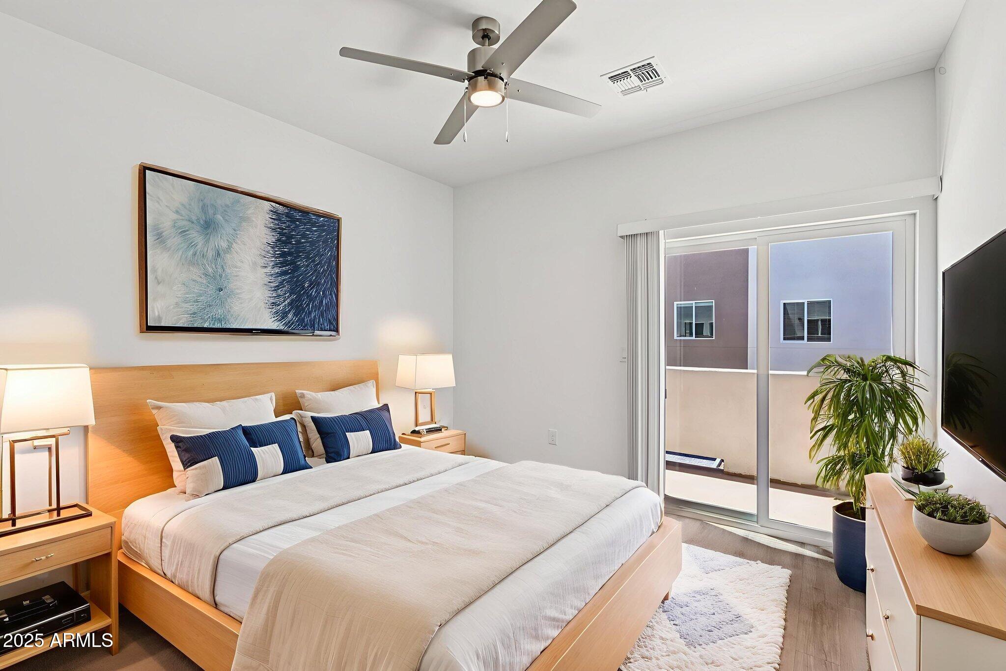 2131 East Jennifer Lynn Way Phoenix, AZ 85022 - Photo 31 of 45 a bedroom with bed and ceiling fan