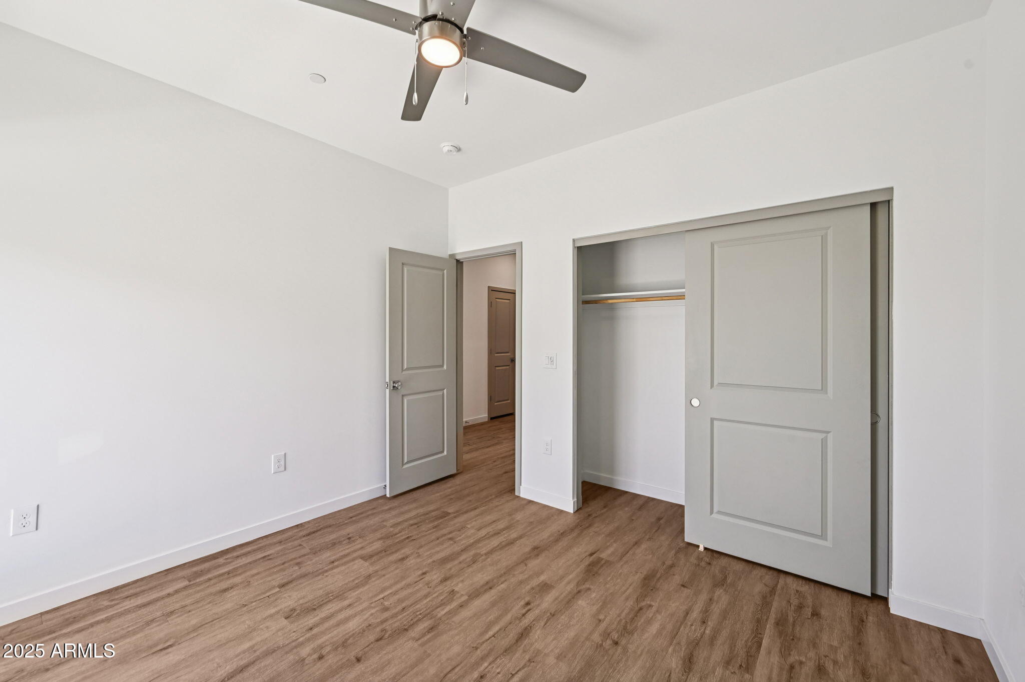 2131 East Jennifer Lynn Way Phoenix, AZ 85022 - Photo 32 of 45 a view of an empty room with wooden floor