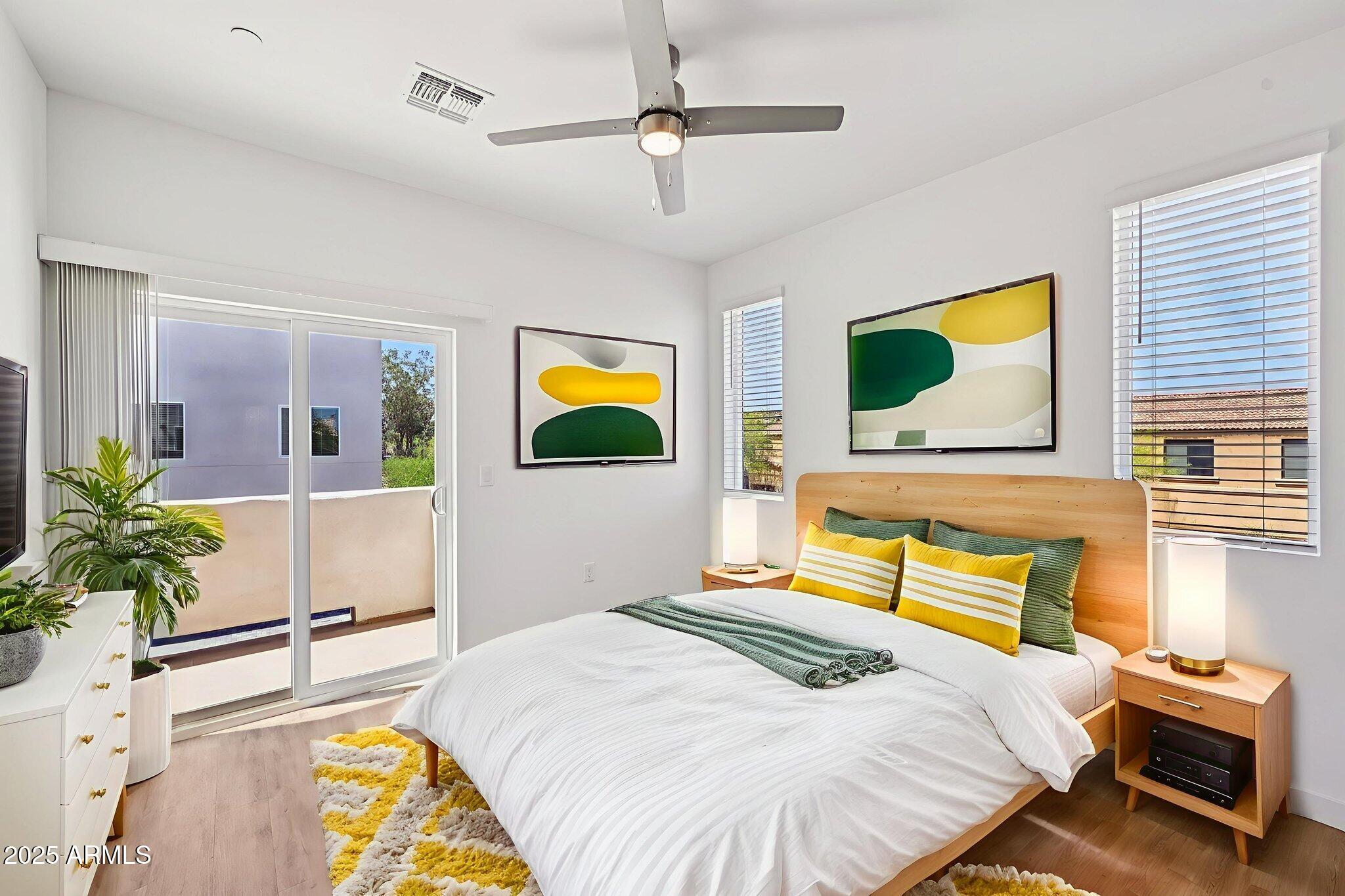 2131 East Jennifer Lynn Way Phoenix, AZ 85022 - Photo 34 of 45 a bedroom with a bed dresser and a window