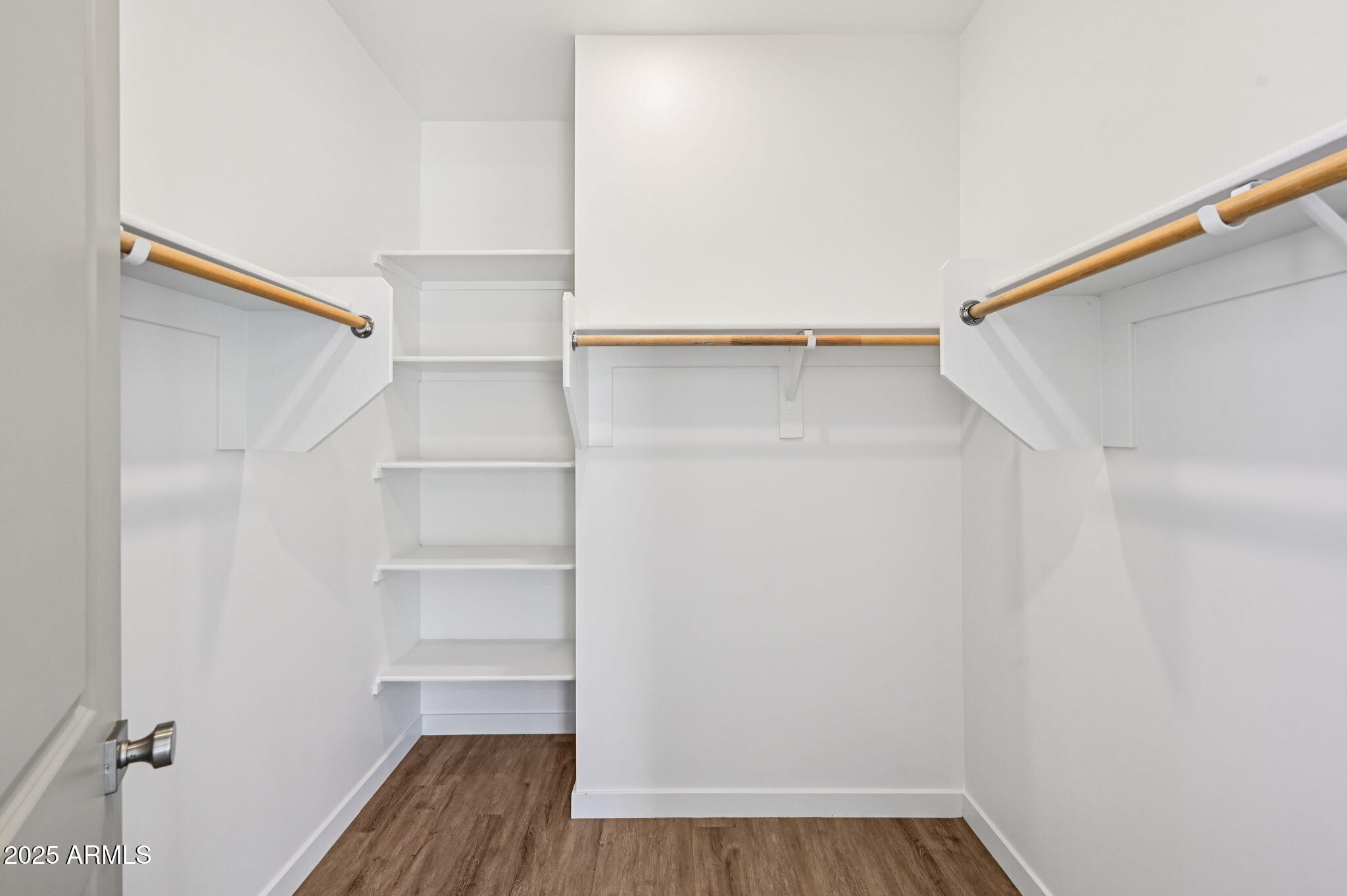 2131 East Jennifer Lynn Way Phoenix, AZ 85022 - Photo 36 of 45 a view of walk in closet with empty racks