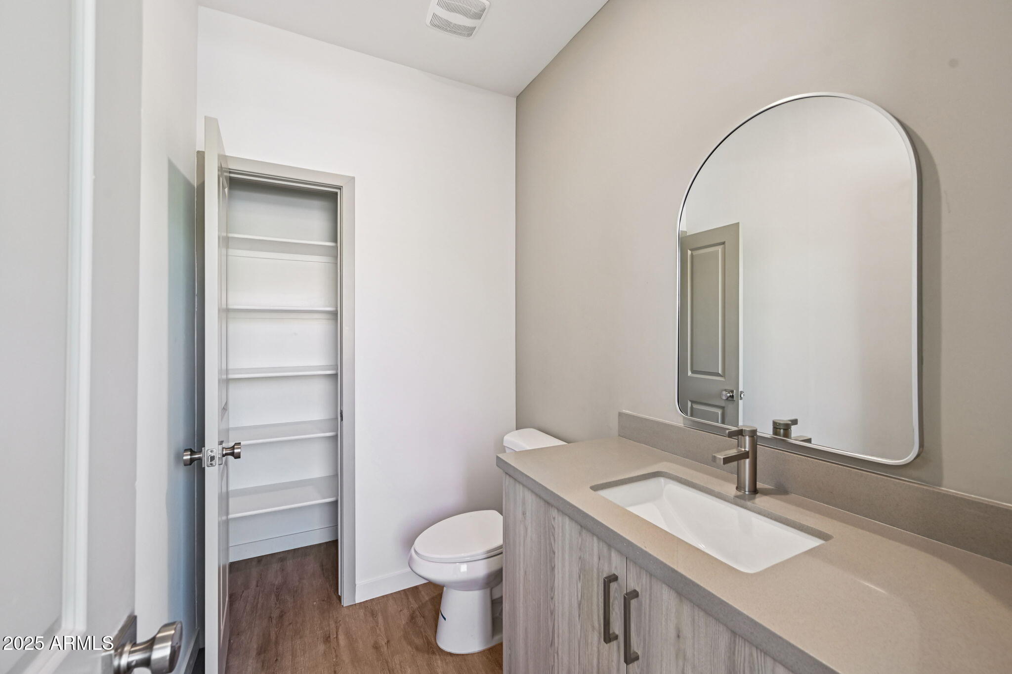 2131 East Jennifer Lynn Way Phoenix, AZ 85022 - Photo 37 of 45 a bathroom with a sink a toilet and a mirror