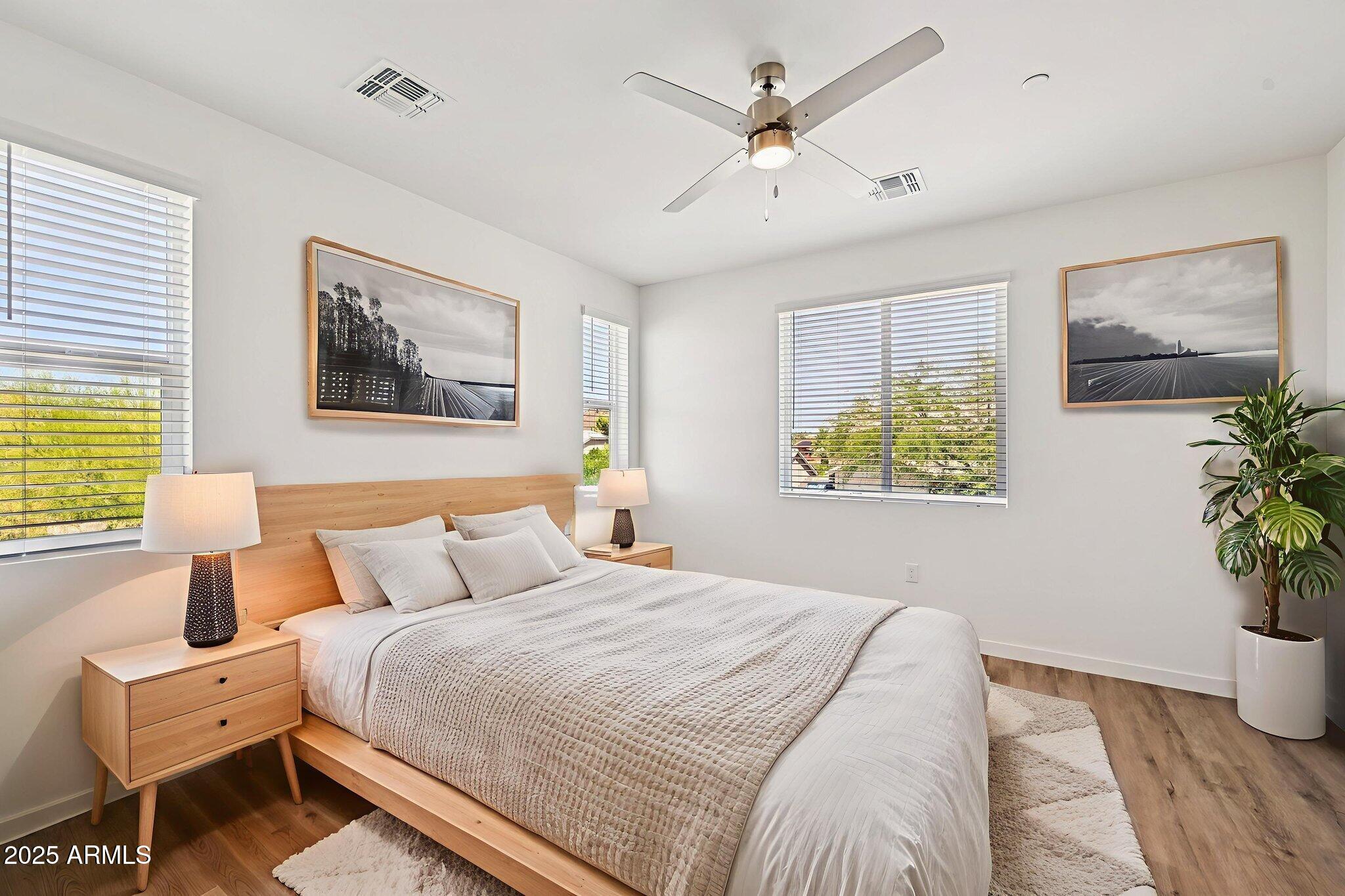 2131 East Jennifer Lynn Way Phoenix, AZ 85022 - Photo 7 of 45 a bedroom with a bed and a painting on the wall