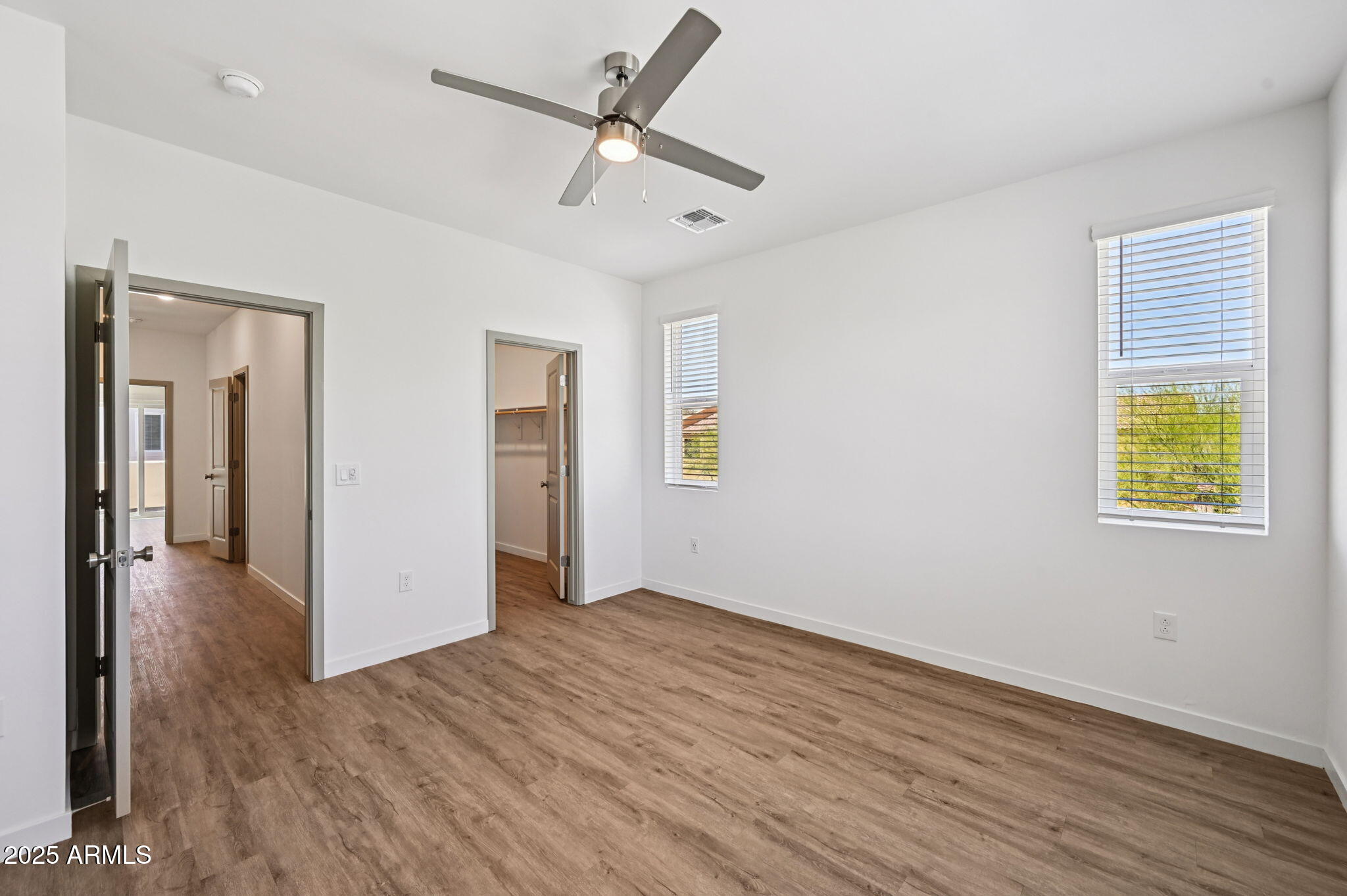 2131 East Jennifer Lynn Way Phoenix, AZ 85022 - Photo 9 of 45 wooden floor in an empty room with a window