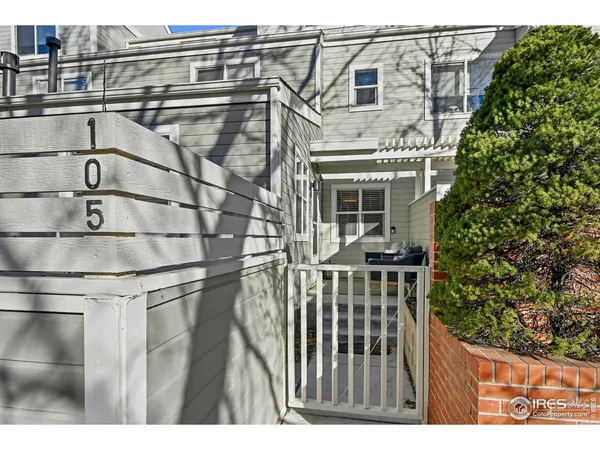 a view of a balcony with wooden floor and a flat screen tv
