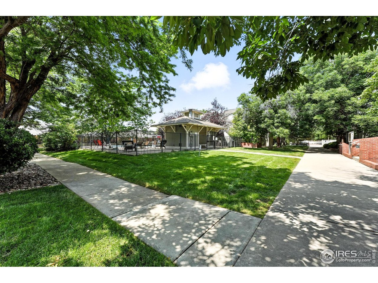 3077 29th Street, Unit 105 Boulder, CO 80301 - Photo 24 of 27 a view of a house with a yard