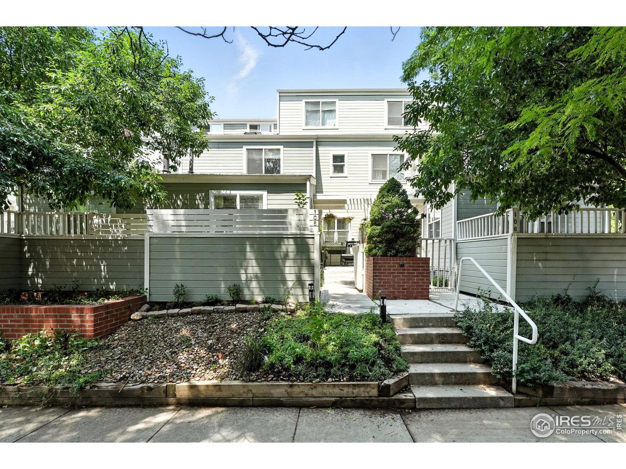 3077 29th Street, Unit 105 Boulder, CO 80301 - Photo 25 of 27 a view of a garden with a bench