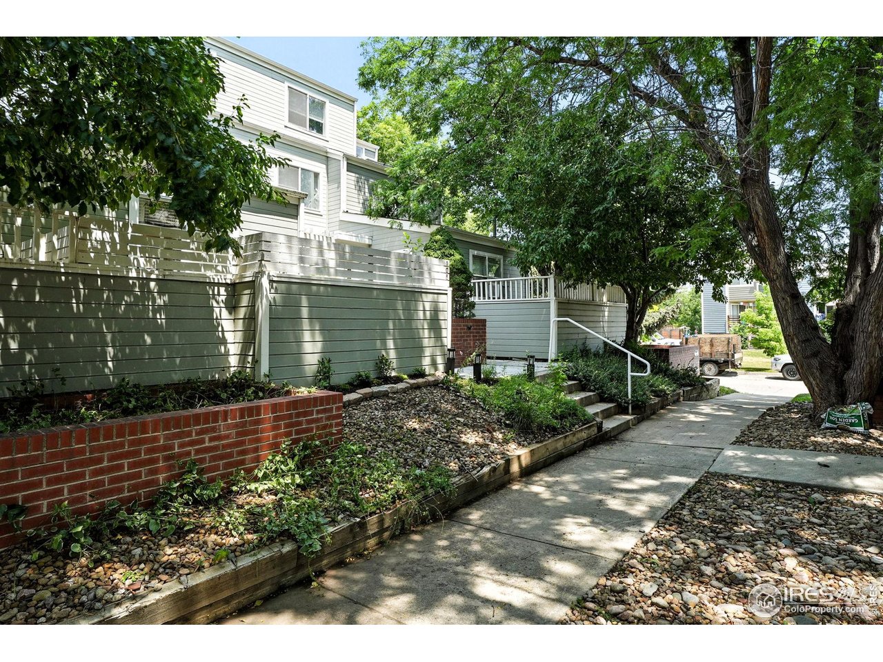 3077 29th Street, Unit 105 Boulder, CO 80301 - Photo 27 of 27 a front view of a house with a garden