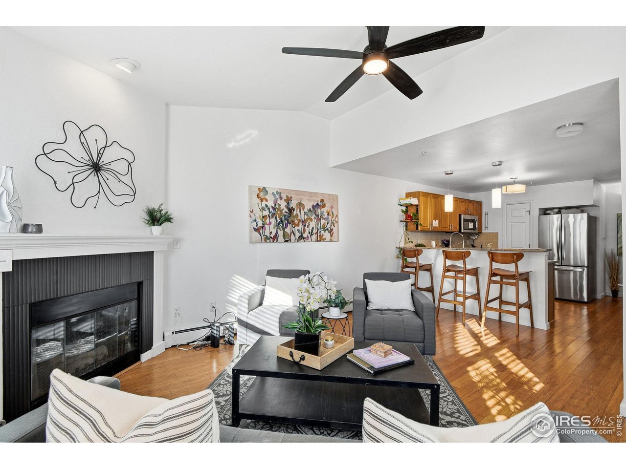 3077 29th Street, Unit 105 Boulder, CO 80301 - Photo 4 of 27 a living room with furniture and a fireplace