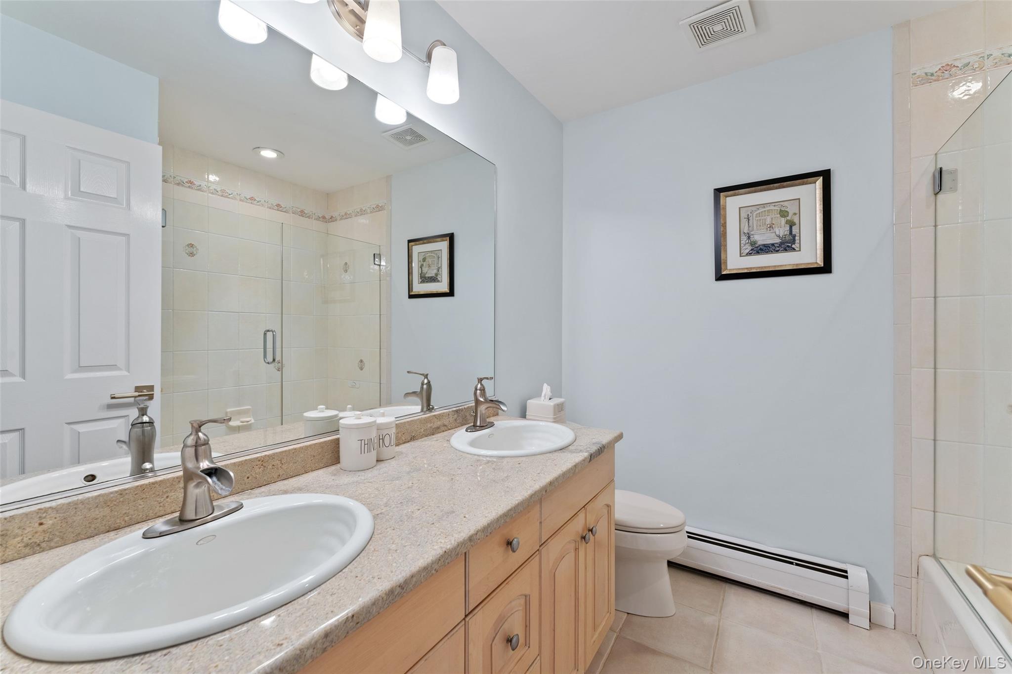 22 Perrin's Peak Road Stony Point, NY 10980 - Photo 44 of 47 Bathroom featuring a baseboard heating unit, tile patterned flooring, and double vanity