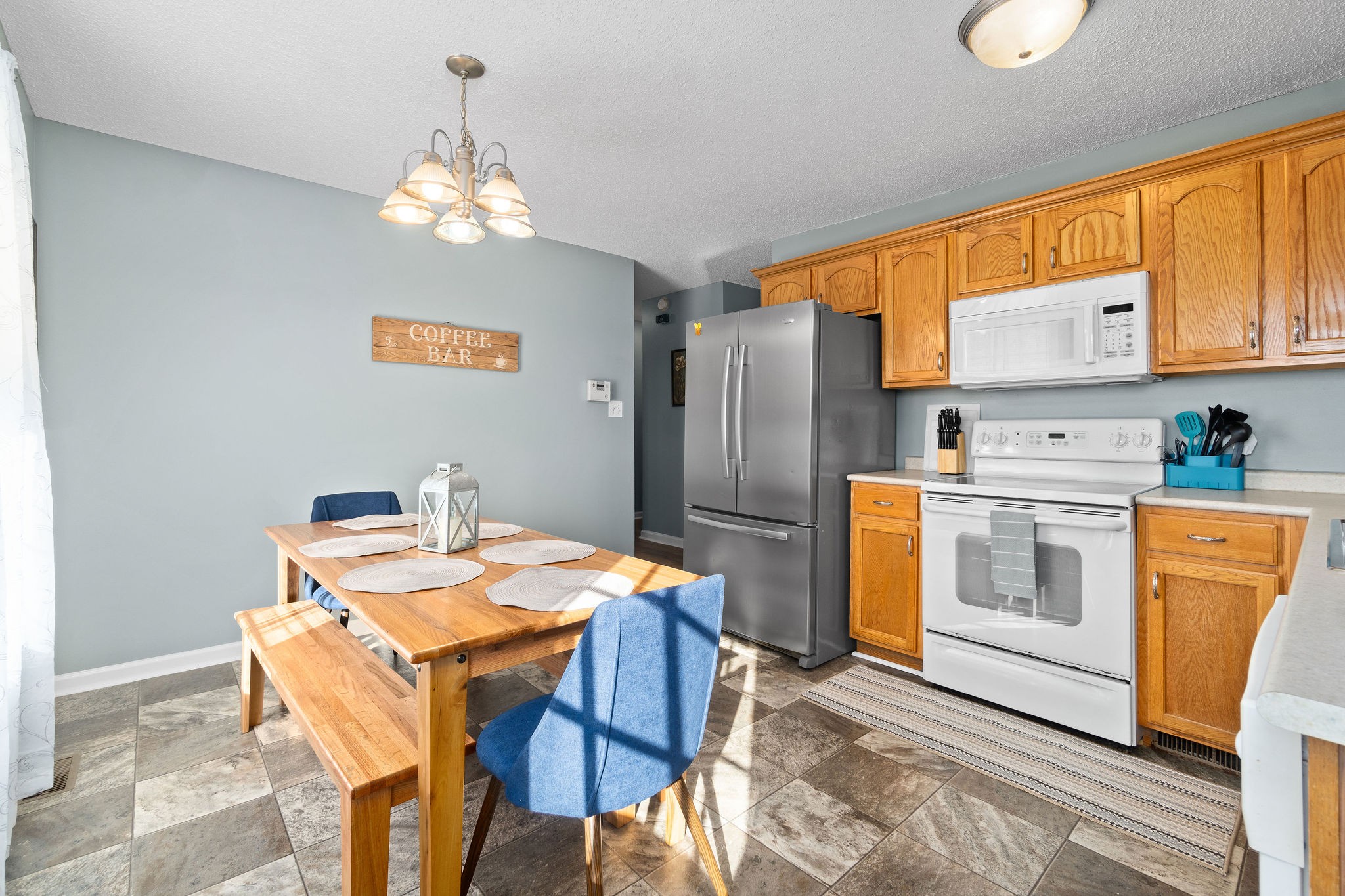 423 Filmore Road Oak Grove, KY 42262 - Photo 10 of 29 a kitchen that has a table chairs and a refrigerator