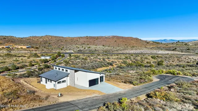 an aerial view of residential houses with an outdoor space