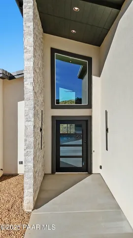 a view of balcony with wooden floor