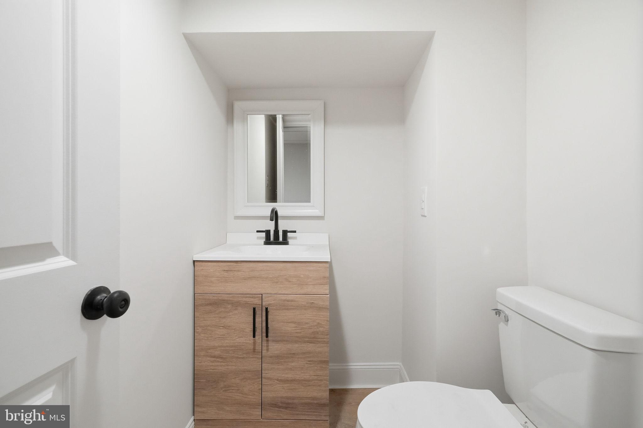 409 South Providence Road Wallingford, PA 19086 - Photo 82 of 106 Sleek and modern half-bath retreat.