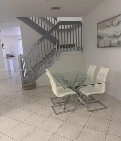 a living room with a couch and a flat screen tv