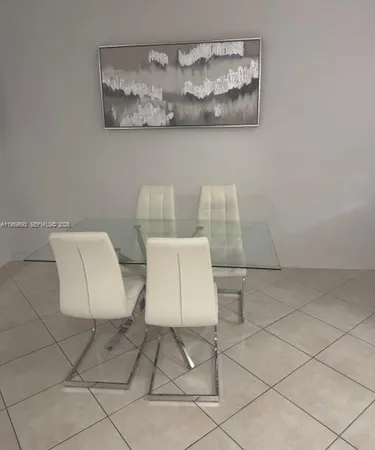 a living room with a couch and a flat screen tv