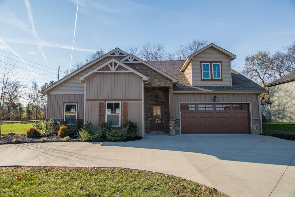1 Beech Grove Clarksville, TN 37043 - Photo 6 of 30 a front view of a house with a yard and garage