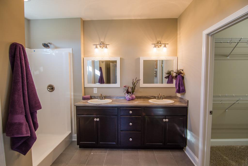1 Beech Grove Clarksville, TN 37043 - Photo 10 of 30 a bathroom with a double vanity sink and mirror