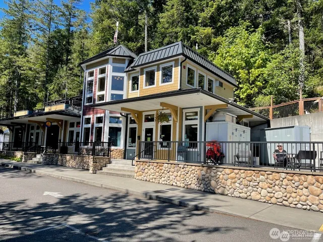 a view of a house with pool table and chairs