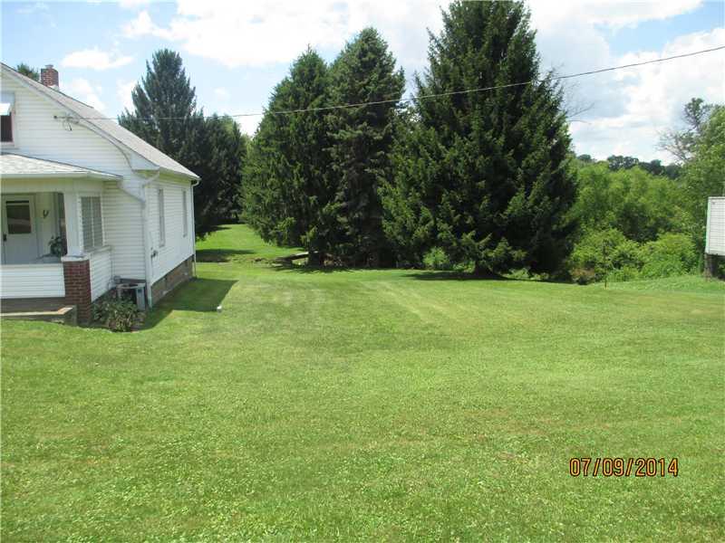 416 Kings Road Apollo, PA 15613 - Photo 2 of 20 Exterior Front. Side view of home. Notice bridge that crosses over the meandering stream to the back area of the property. Great venue for entertaining.
