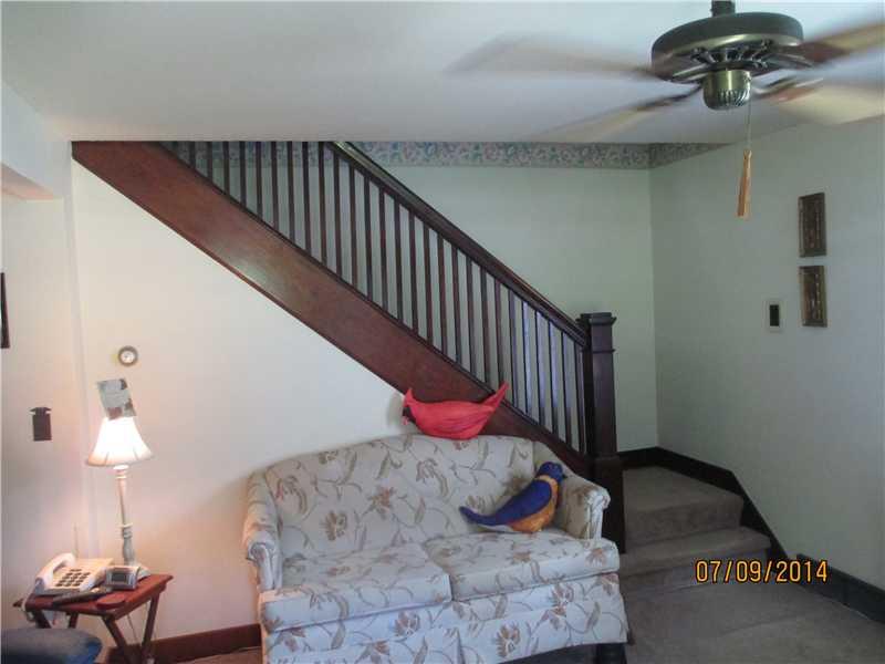 416 Kings Road Apollo, PA 15613 - Photo 12 of 20 Living Room. Arts and Crafts style turned stairway. Home has wood floors under carpet.