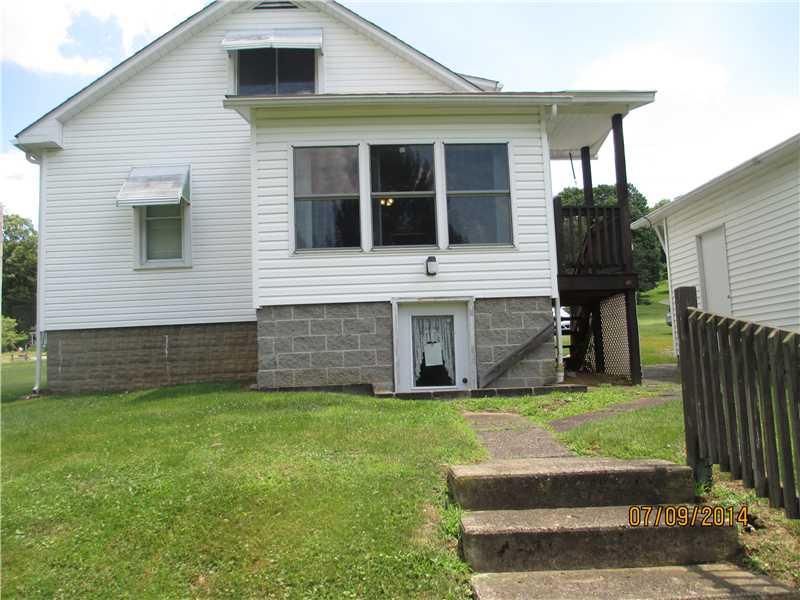 416 Kings Road Apollo, PA 15613 - Photo 4 of 20 Exterior Back. Sunroom addition with walkout basement - great area for entry for your pups and others. Notice cement block is more designer style. Basement is spacious and includes oversized wash sinks.