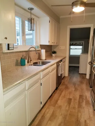 a kitchen with a sink and cabinets