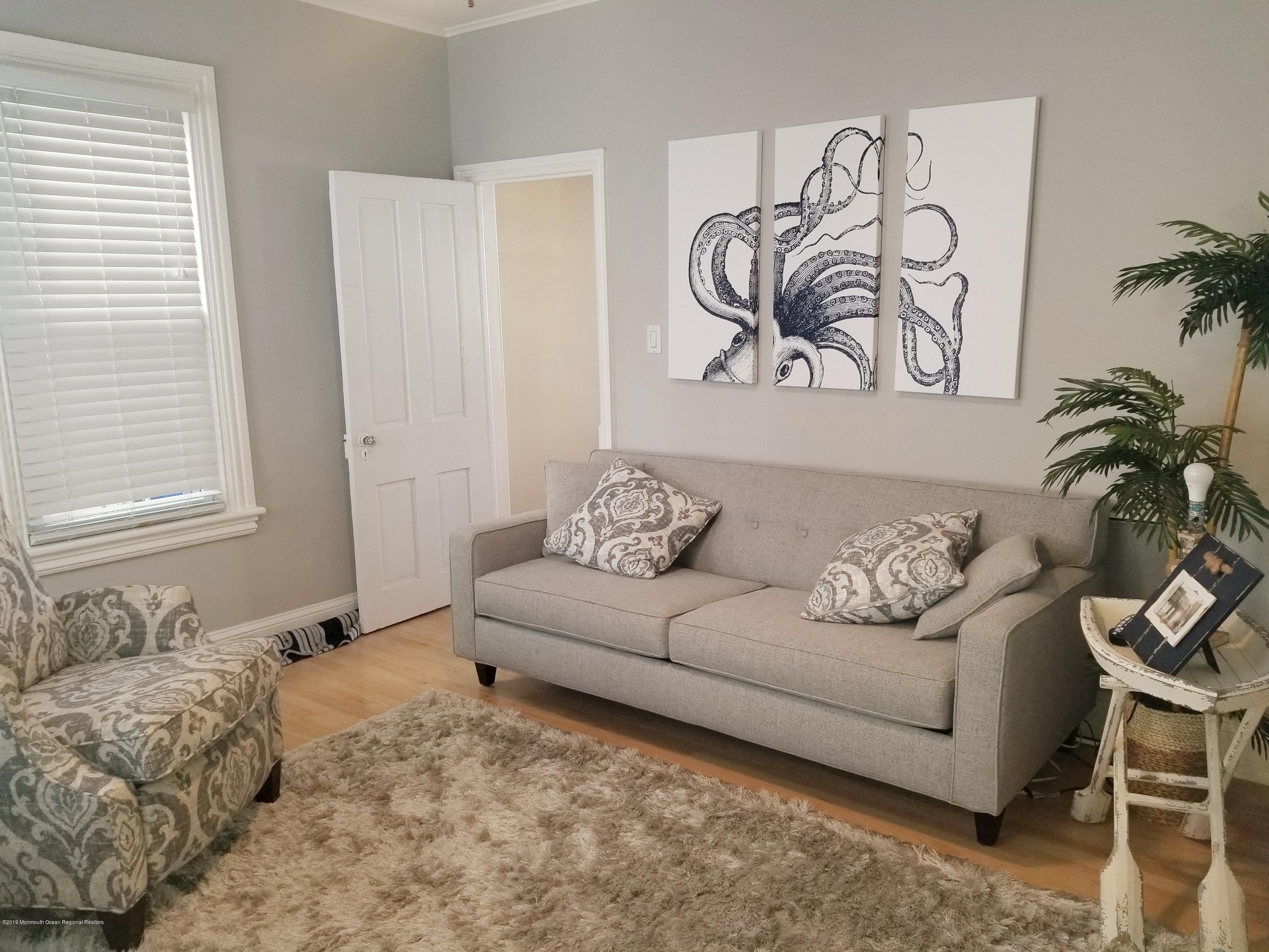 12 Surf Avenue Ocean Grove, NJ 07756 - Photo 14 of 26 a living room with furniture and a window