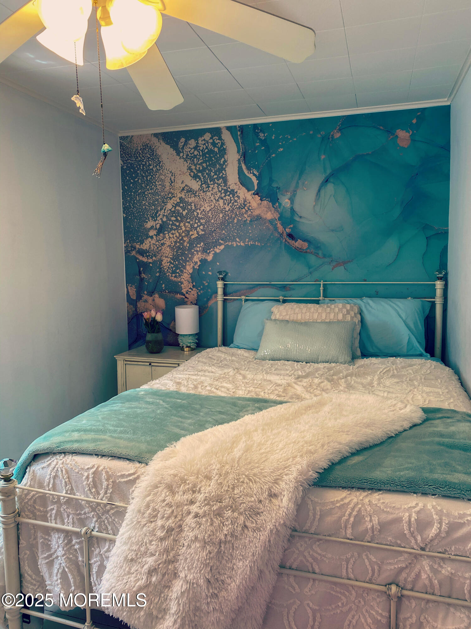 12 Surf Avenue Ocean Grove, NJ 07756 - Photo 19 of 26 a bedroom with a bed and a chandelier