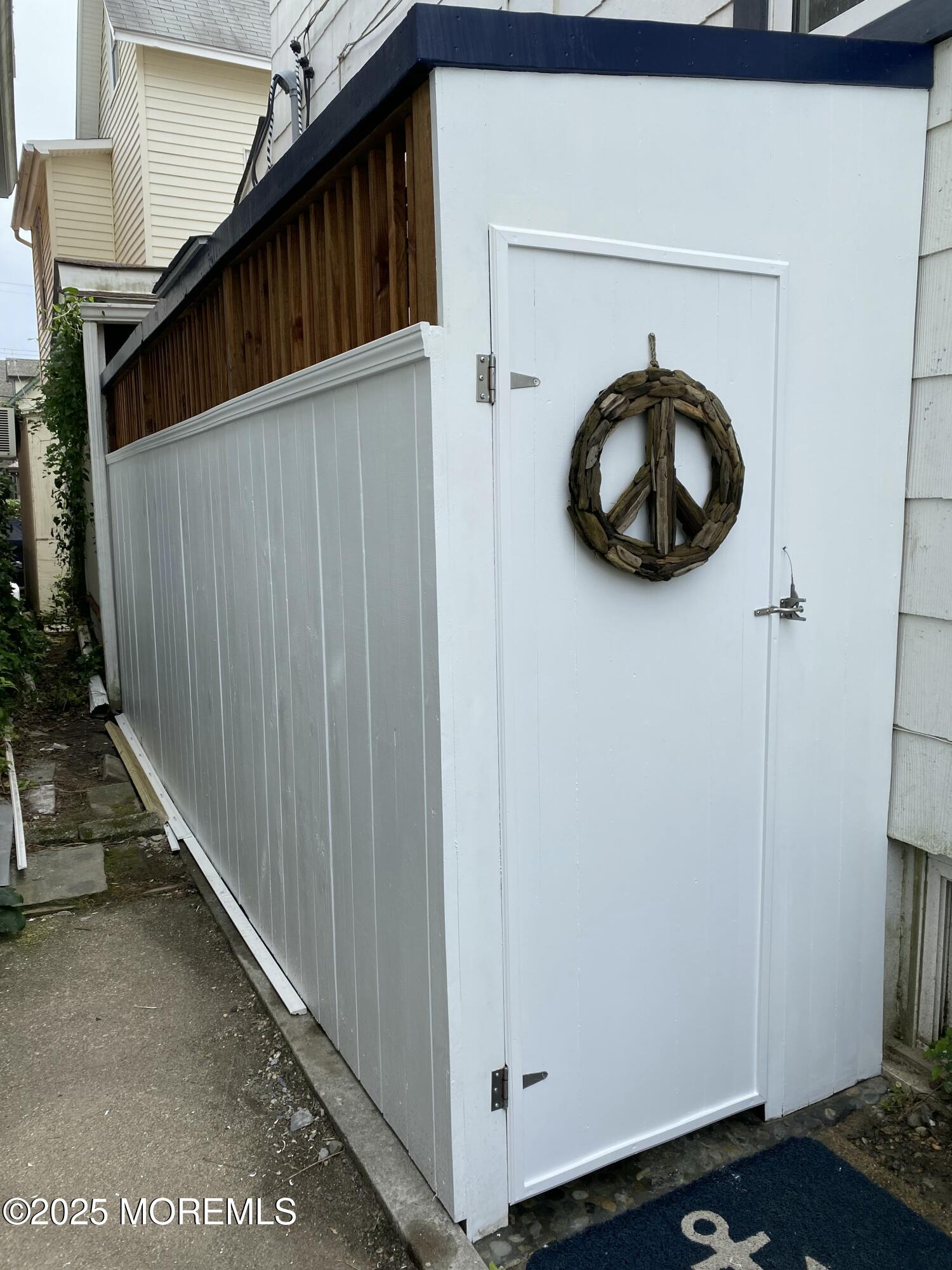 12 Surf Avenue Ocean Grove, NJ 07756 - Photo 23 of 26 a view of a room with rack and stairs