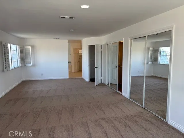 a view of empty room with windows