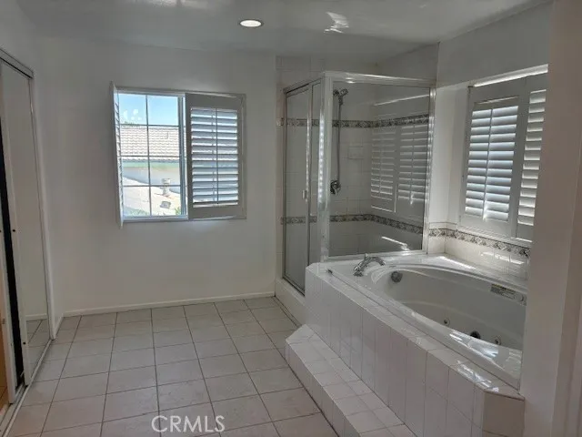 a view of a house with a tree and a yard