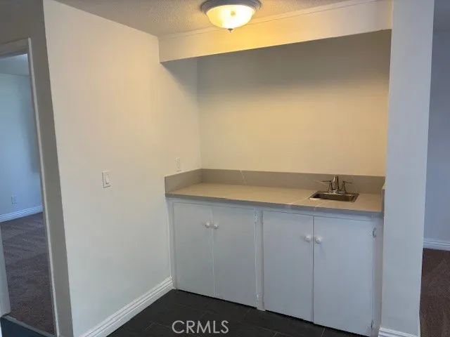 a kitchen with a sink and a window