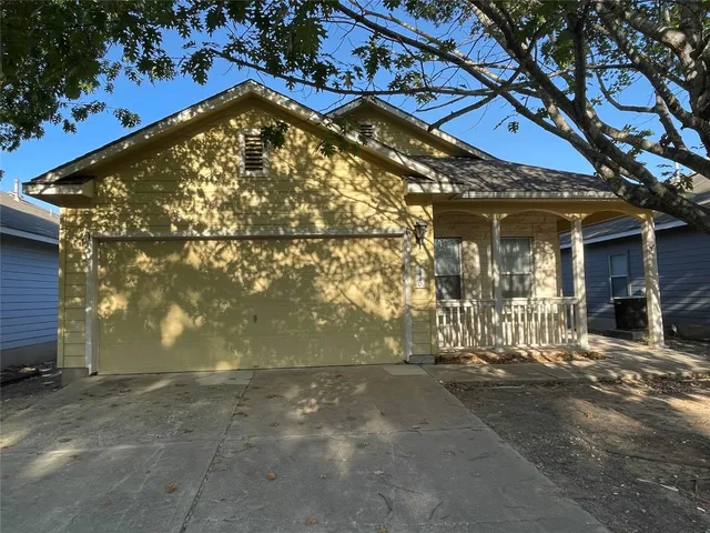 a view of a house with a tree