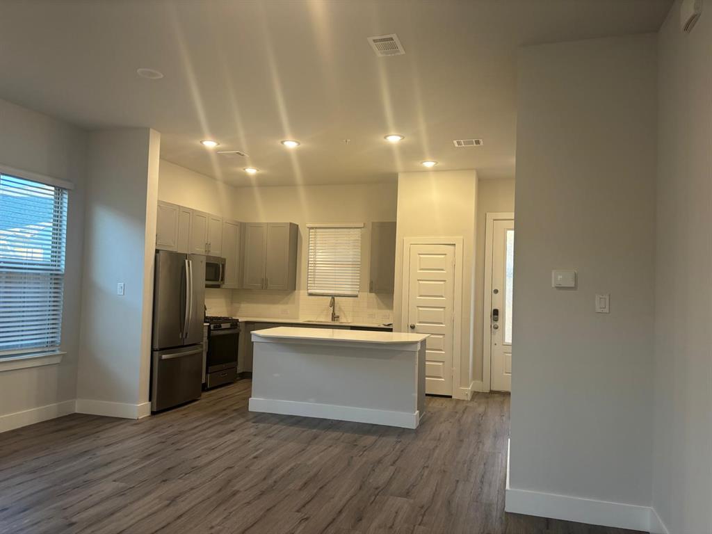 825 West Mayfield Road, Unit 224 Arlington, TX 76015 - Photo 6 of 25 a view of kitchen with wooden floor