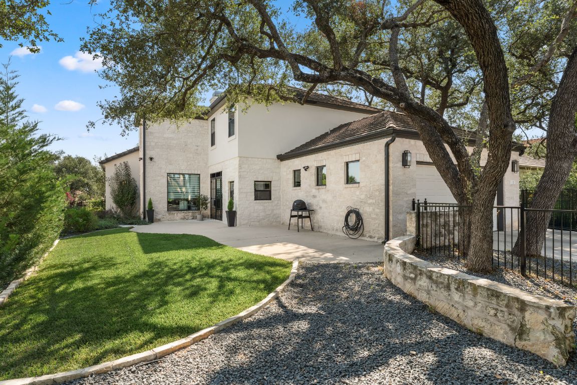 8 Hightrail Way The Hills, TX 78738 - Photo 15 of 15 a front view of a house with garden