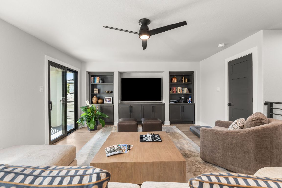 8 Hightrail Way The Hills, TX 78738 - Photo 8 of 15 a living room with furniture and a flat screen tv