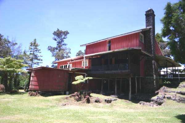 19-4124 Haunani Road Volcano, HI 96785 - Photo 8 of 23 a front view of a house with a yard