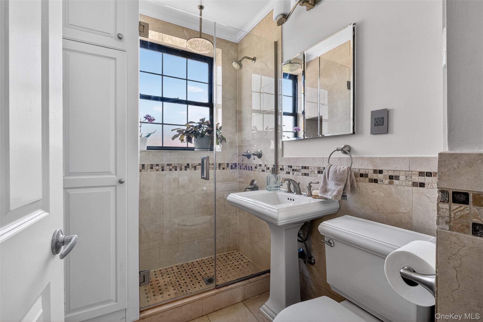 824 Bronx River Road, Unit 7C Bronxville, NY 10708 - Photo 10 of 13 a bathroom with a sink toilet and shower
