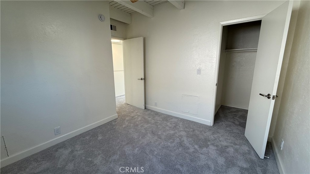 33852 Copper Lantern Street, Unit F Dana Point, CA 92629 - Photo 14 of 44 an empty room that has a grey walls