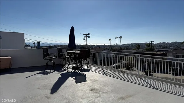 a view of a patio with table and chairs