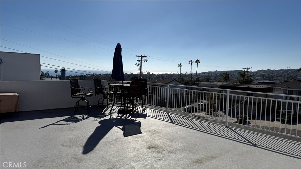 33852 Copper Lantern Street, Unit F Dana Point, CA 92629 - Photo 25 of 44 a view of a patio with table and chairs