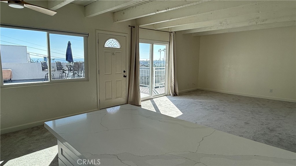 33852 Copper Lantern Street, Unit F Dana Point, CA 92629 - Photo 8 of 44 a view of a room that has a bench in it