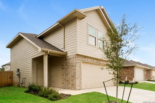 a view of house with a yard