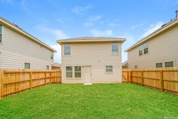 a view of a backyard with plants