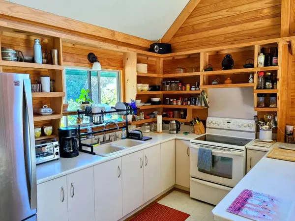 a kitchen with a stove and cabinets