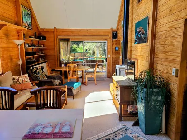 an outdoor living space with patio furniture and potted plants