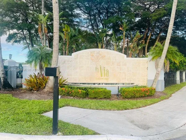 a black car in front of a house