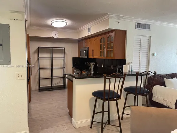 a view of a livingroom with furniture and windows